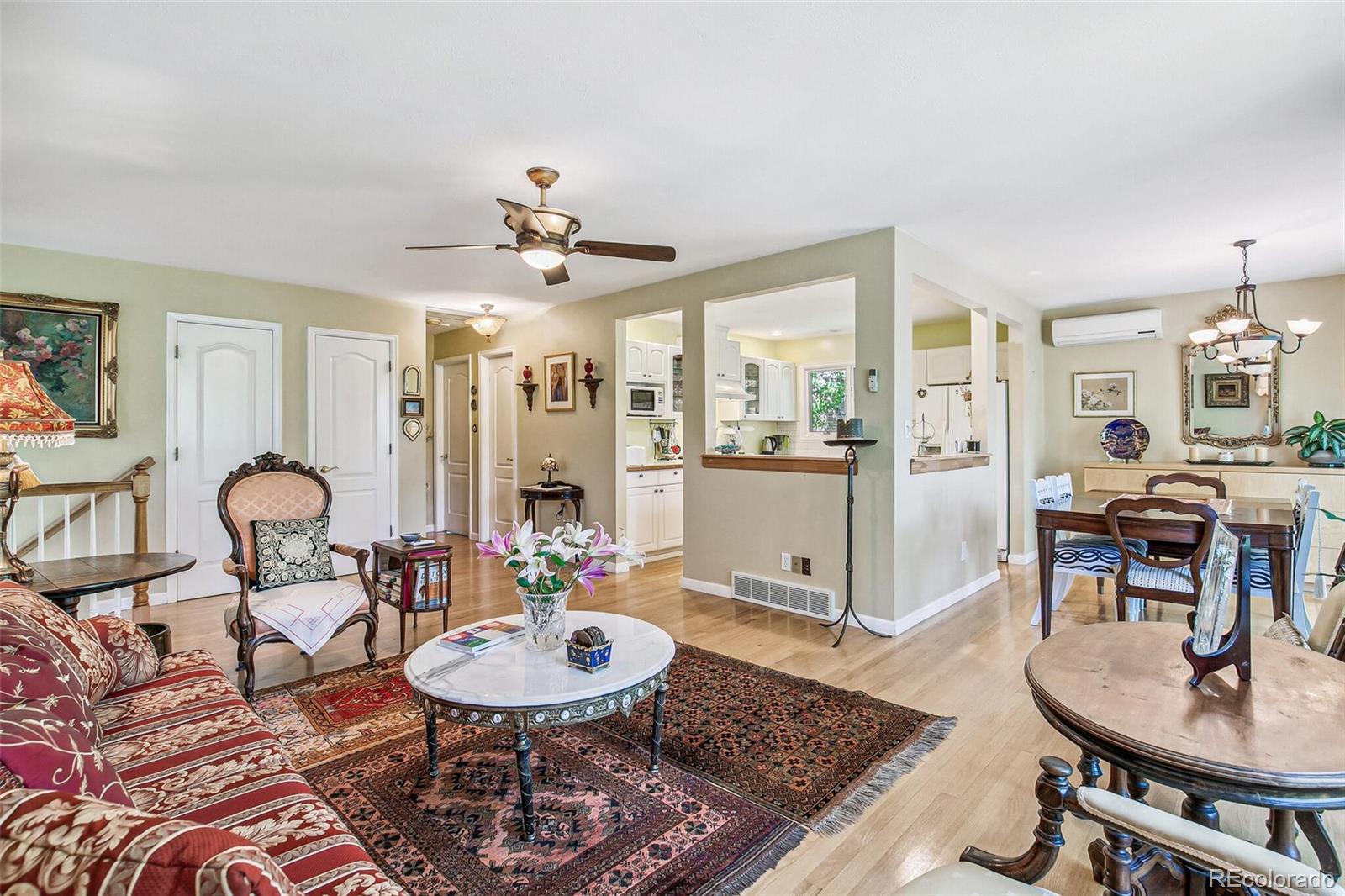 1080 Ithaca Drive Boulder, CO 80305 - Photo 25 of 35 a living room with furniture and kitchen view