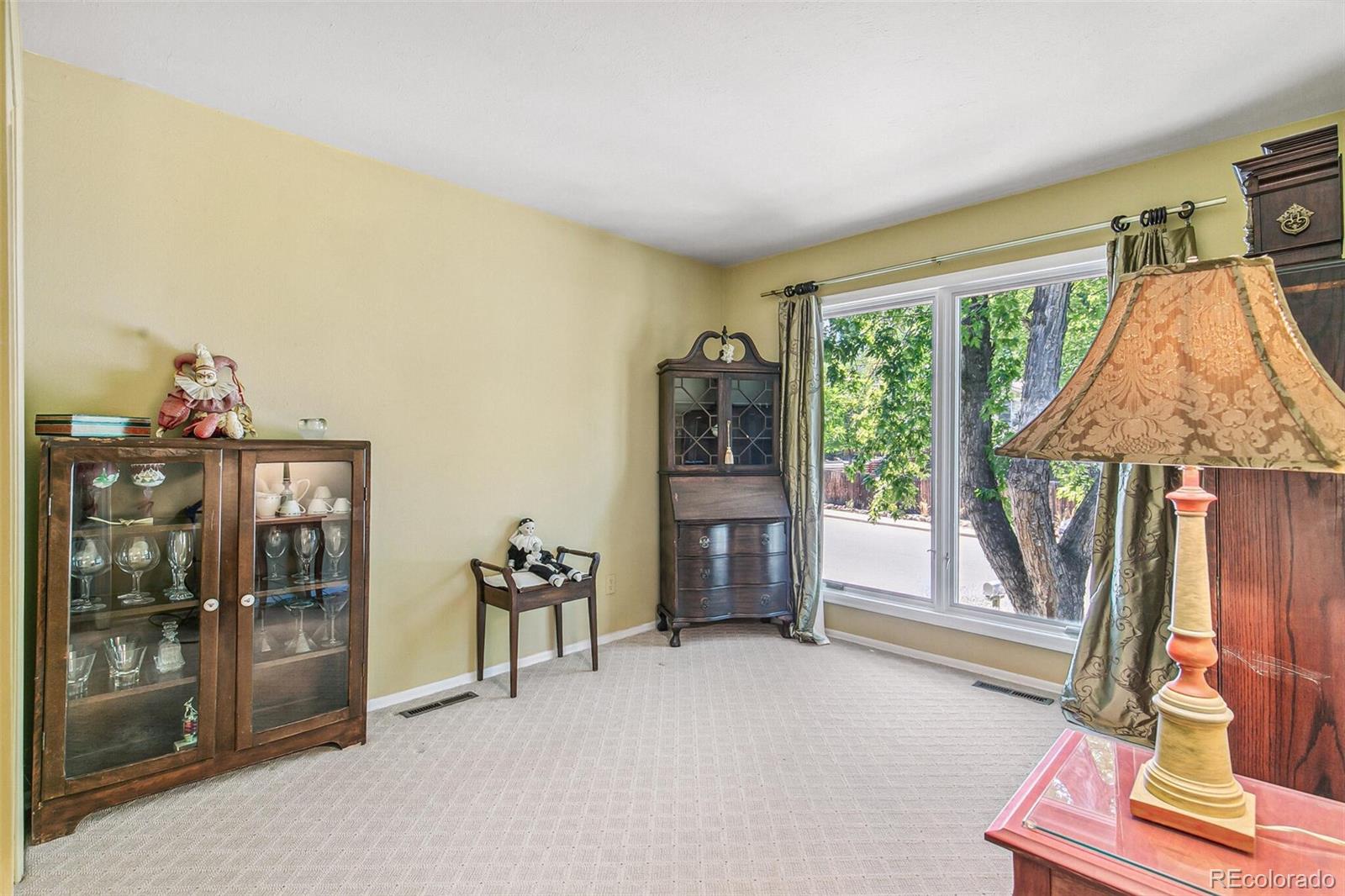 1080 Ithaca Drive Boulder, CO 80305 - Photo 27 of 35 a living room with furniture and a flat screen tv