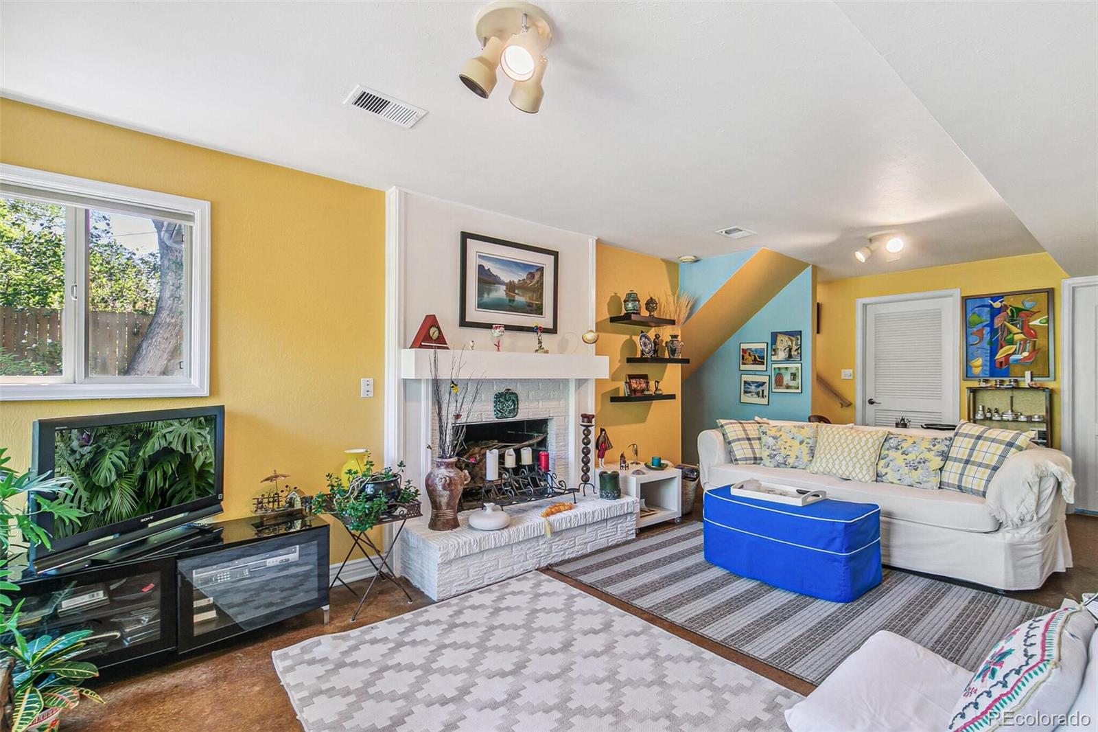 1080 Ithaca Drive Boulder, CO 80305 - Photo 28 of 35 a living room with furniture fireplace and a large window
