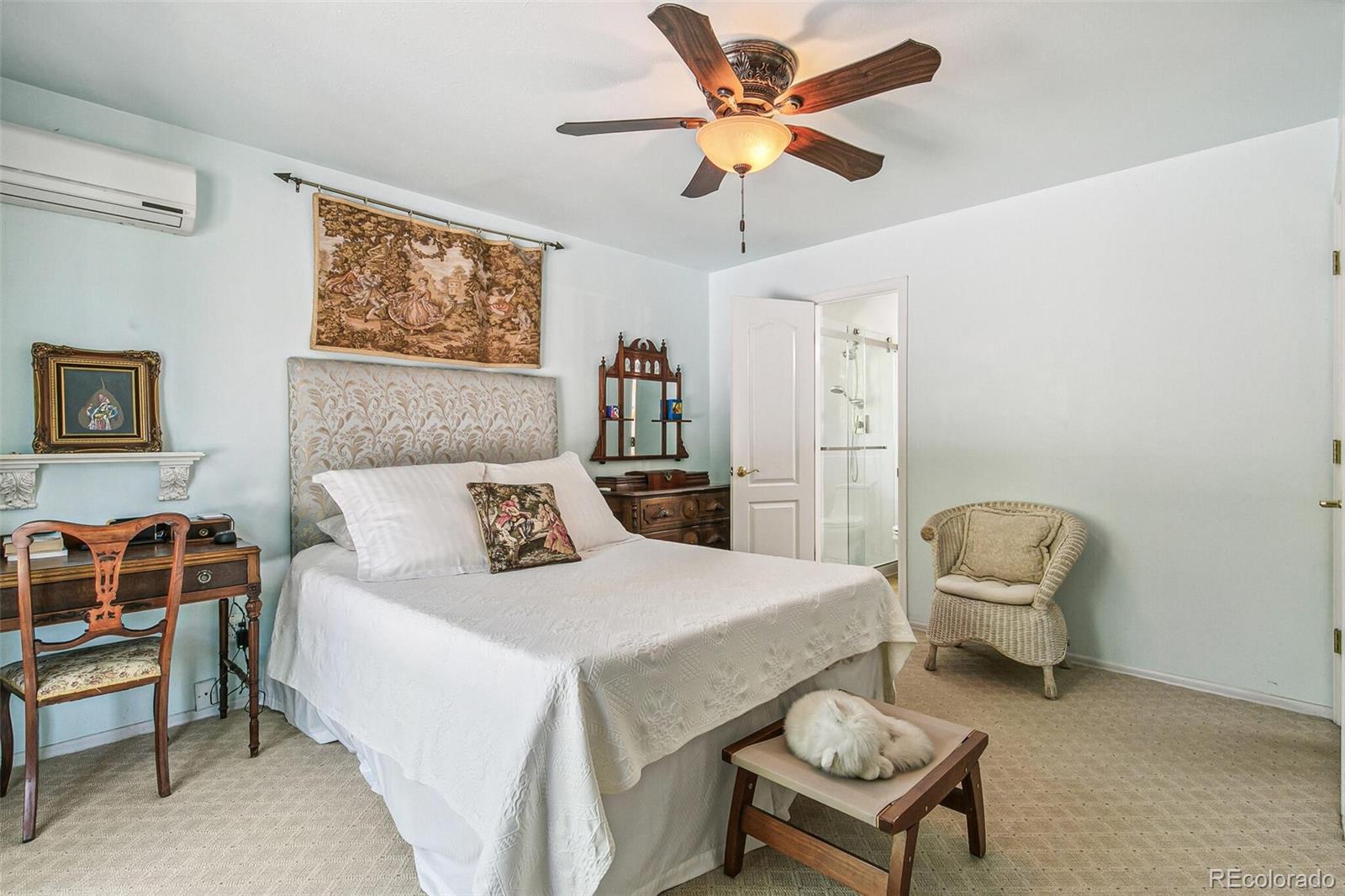 1080 Ithaca Drive Boulder, CO 80305 - Photo 33 of 35 a bedroom with a bed a couch and a painting on the wall