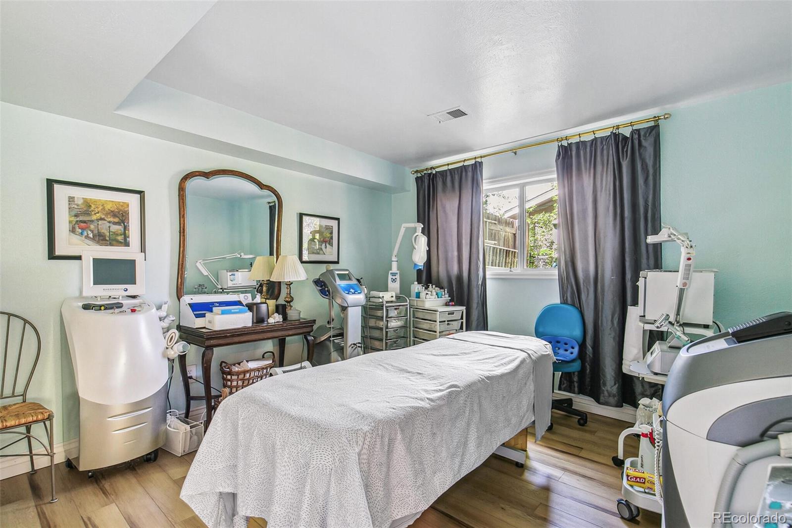 1080 Ithaca Drive Boulder, CO 80305 - Photo 35 of 35 a bedroom with a bed and wooden floor