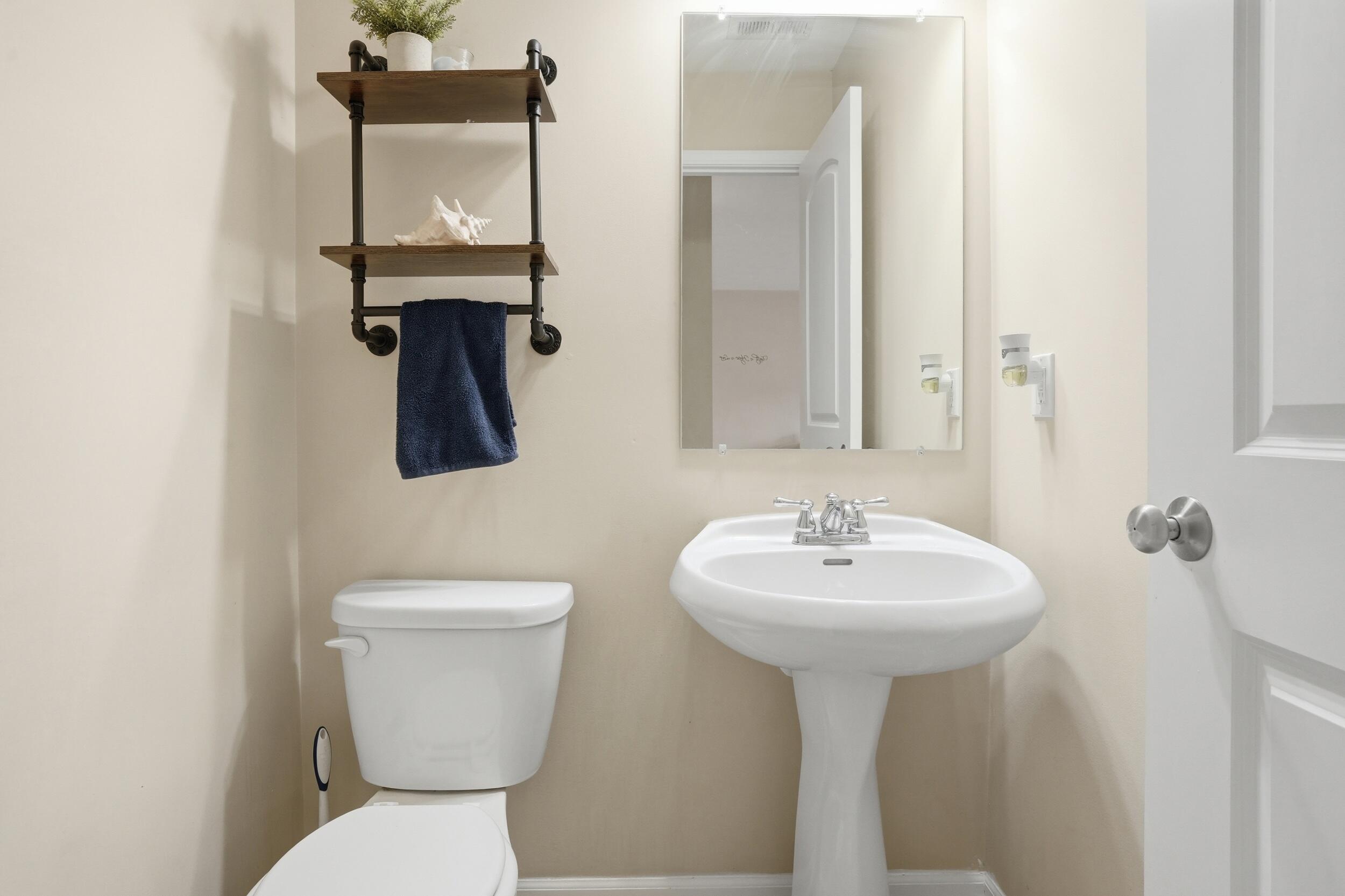 14019 Paramount Way Cedar Lake, IN 46303 - Photo 11 of 17 a bathroom with a toilet sink and mirror