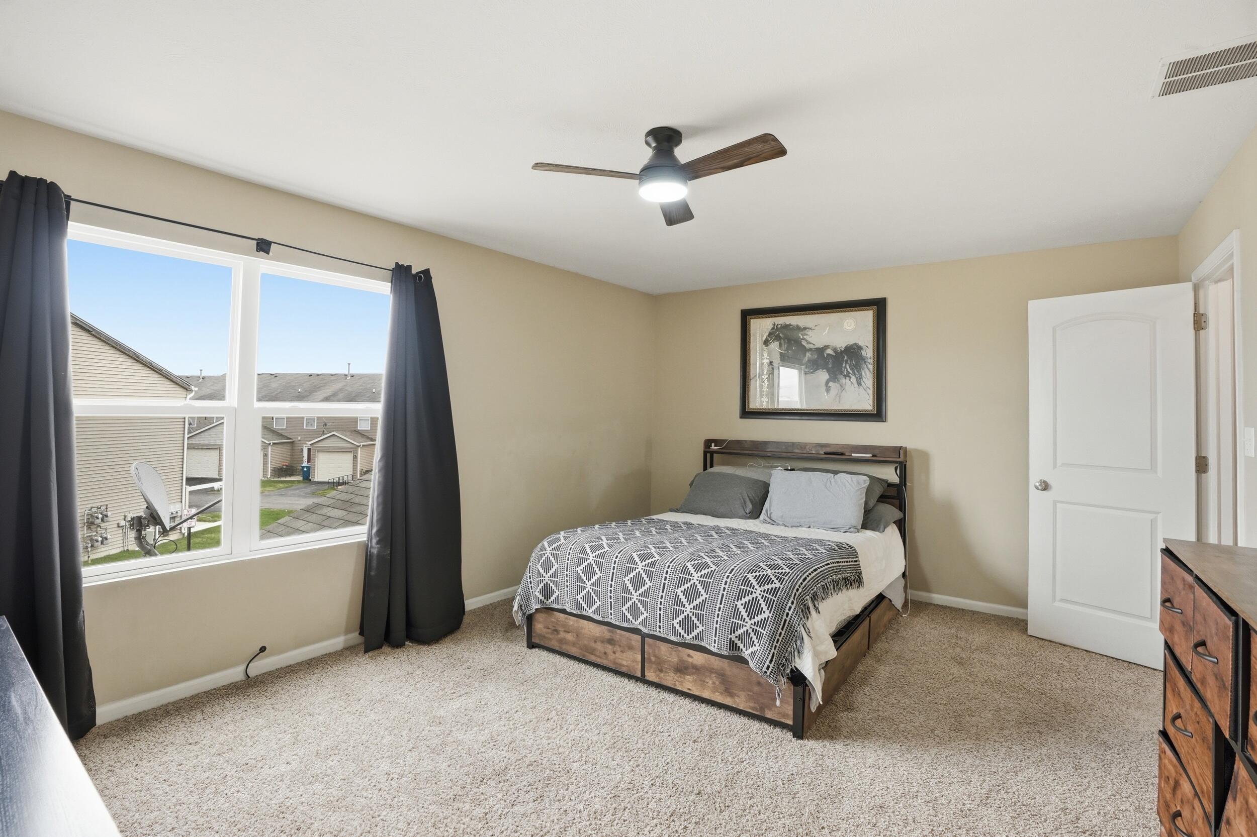 14019 Paramount Way Cedar Lake, IN 46303 - Photo 7 of 17 a bedroom with a bed and a large window