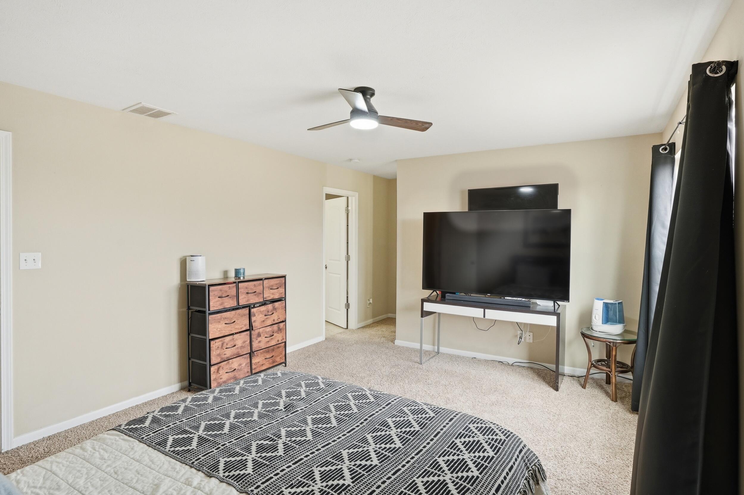 14019 Paramount Way Cedar Lake, IN 46303 - Photo 8 of 17 a bedroom with a bed and a flat screen tv