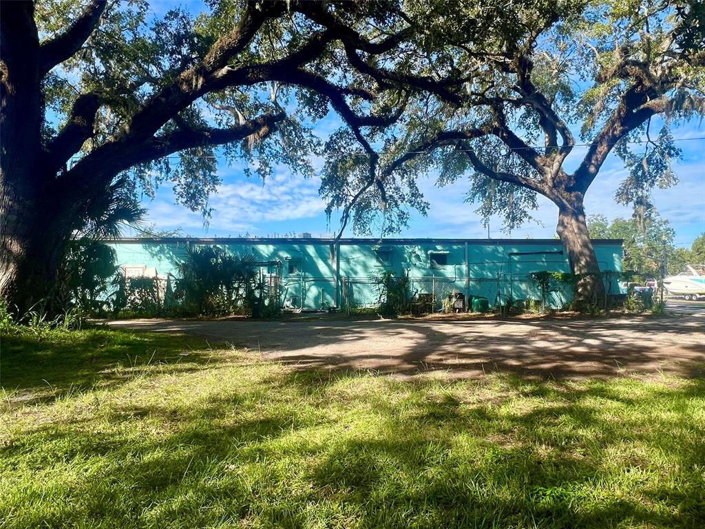 0 Laurel Avenue Sanford, FL 32771 - Photo 13 of 15 a view of a yard in front of a house with a large tree