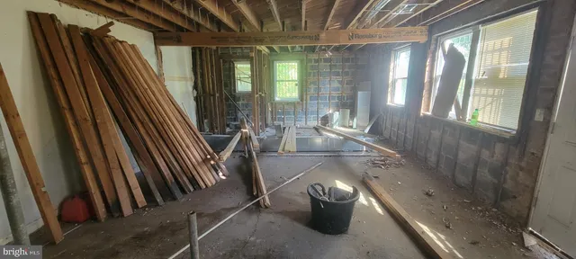 a view of an entryway and livingroom