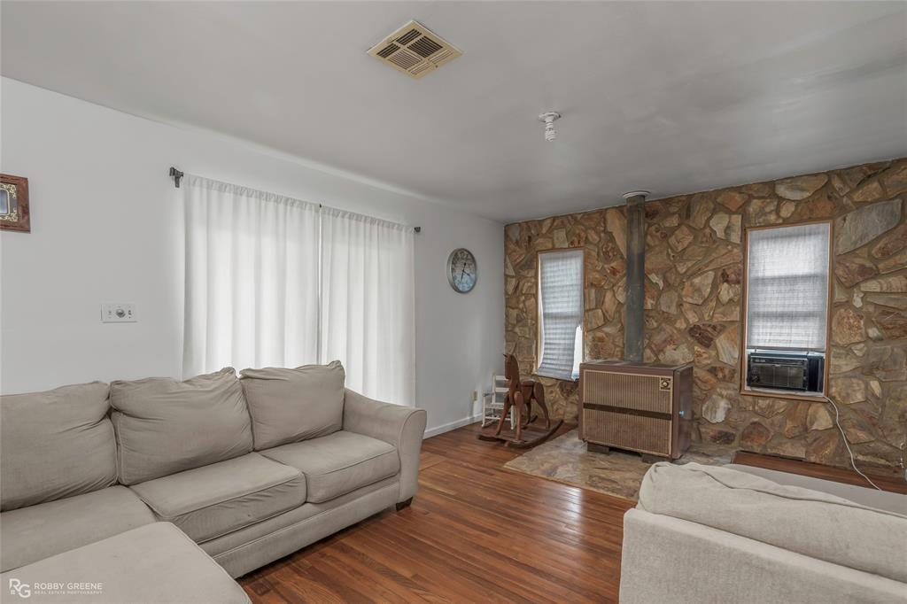 5725 Harper Road Keithville, LA 71047 - Photo 15 of 35 a living room with furniture and a flat screen tv