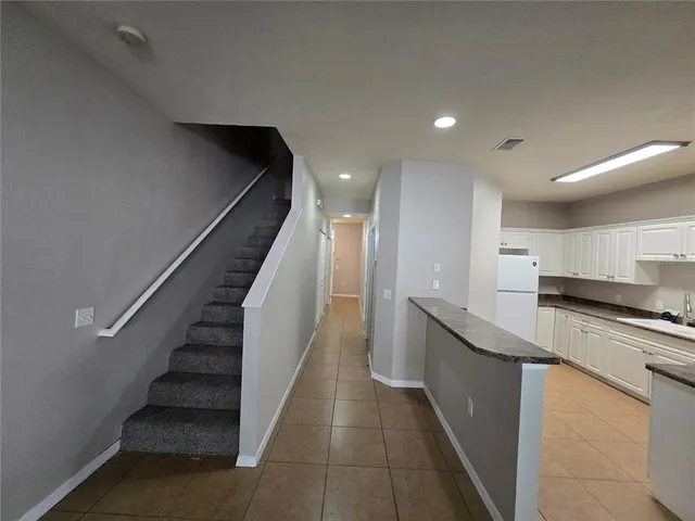 a kitchen with stainless steel appliances granite countertop a sink and stove top oven