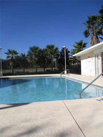a view of swimming pool with a yard
