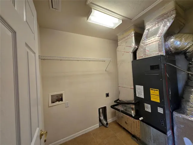 a view of empty room with windows