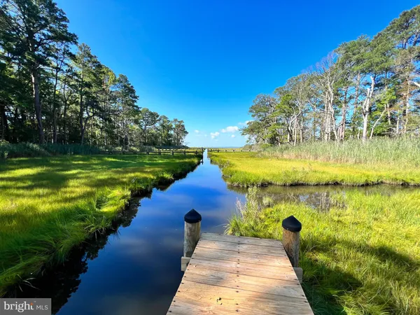 a view of a lake with a big yard