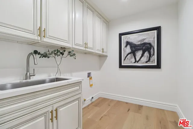 a bathroom with a sink and cabinets