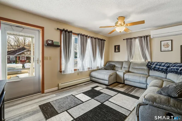 a living room with furniture and a window