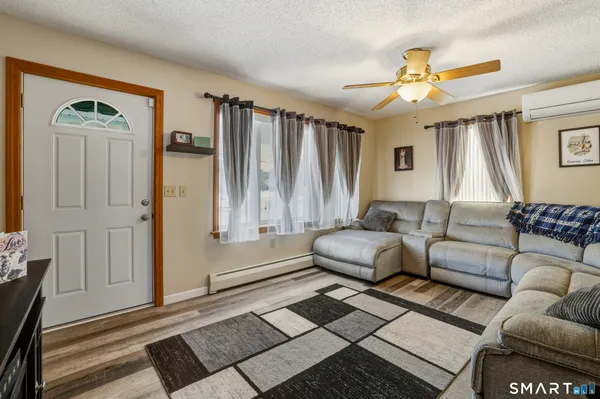 a living room with furniture and a window