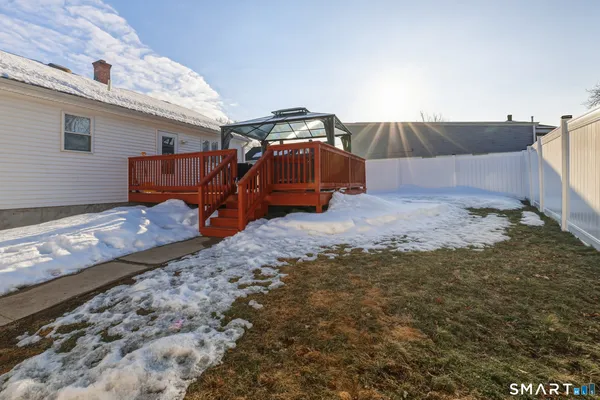 a backyard of a house with barbeque oven