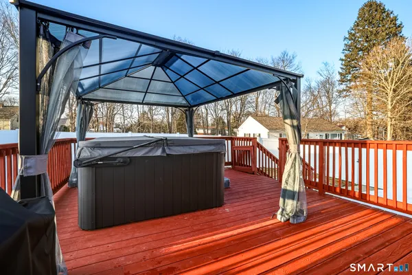 a view of outdoor space with wooden floor and barbeque