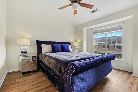 a bedroom with a bed and window
