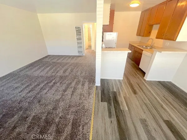 a bed room with a bed and a night stand