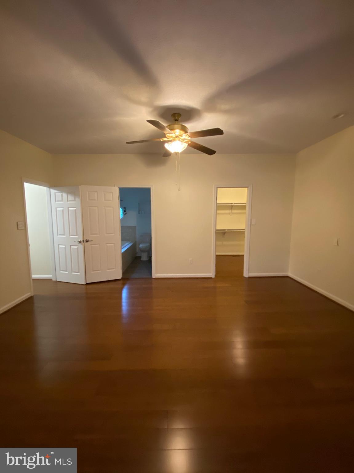 11905 Mill Bridge Road Lusby, MD 20657 - Photo 48 of 59 a view of empty room with wooden floor and fan