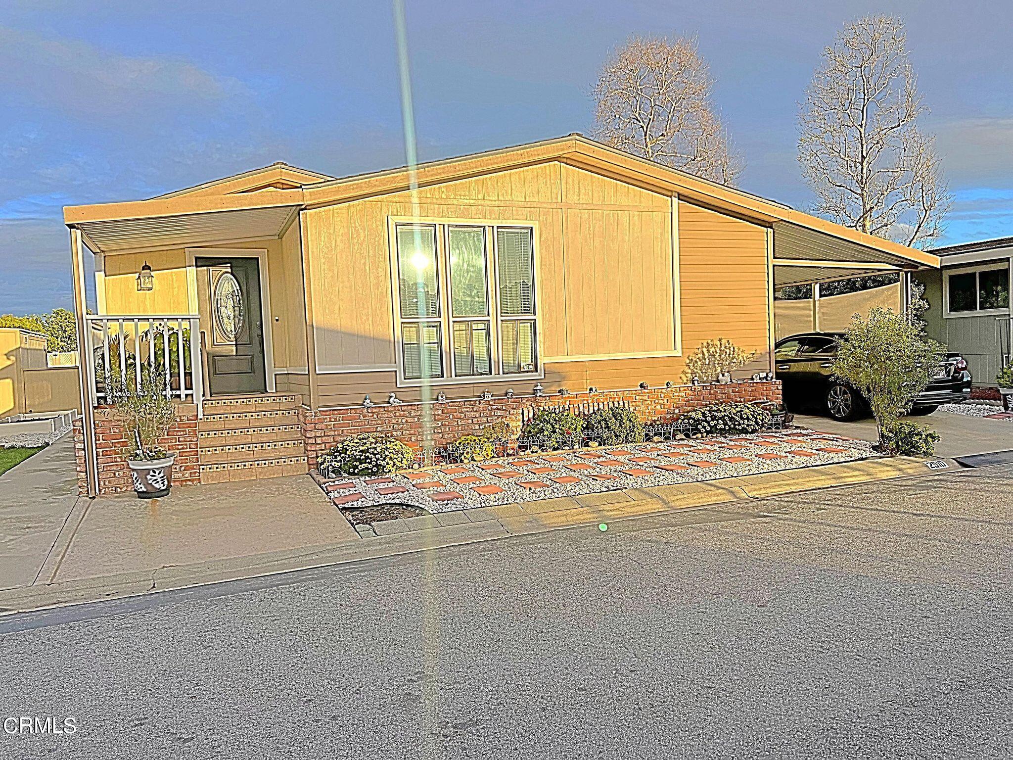 2510 Elderberry Drive, Unit 60 Oxnard, CA 93036 - Photo 1 of 37 a bathroom with a granite countertop sink and a large window