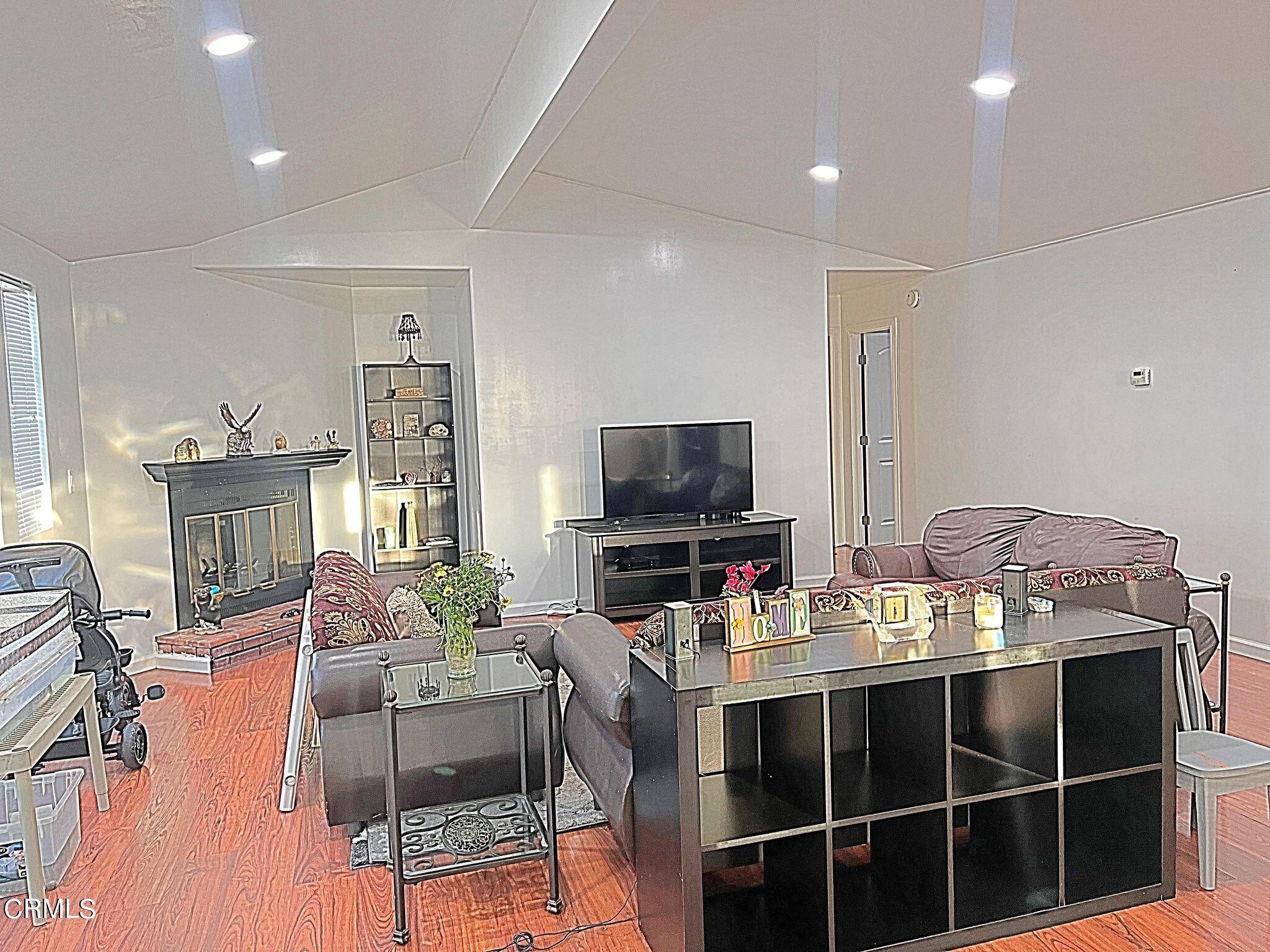 2510 Elderberry Drive, Unit 60 Oxnard, CA 93036 - Photo 12 of 37 a living room with furniture and a flat screen tv