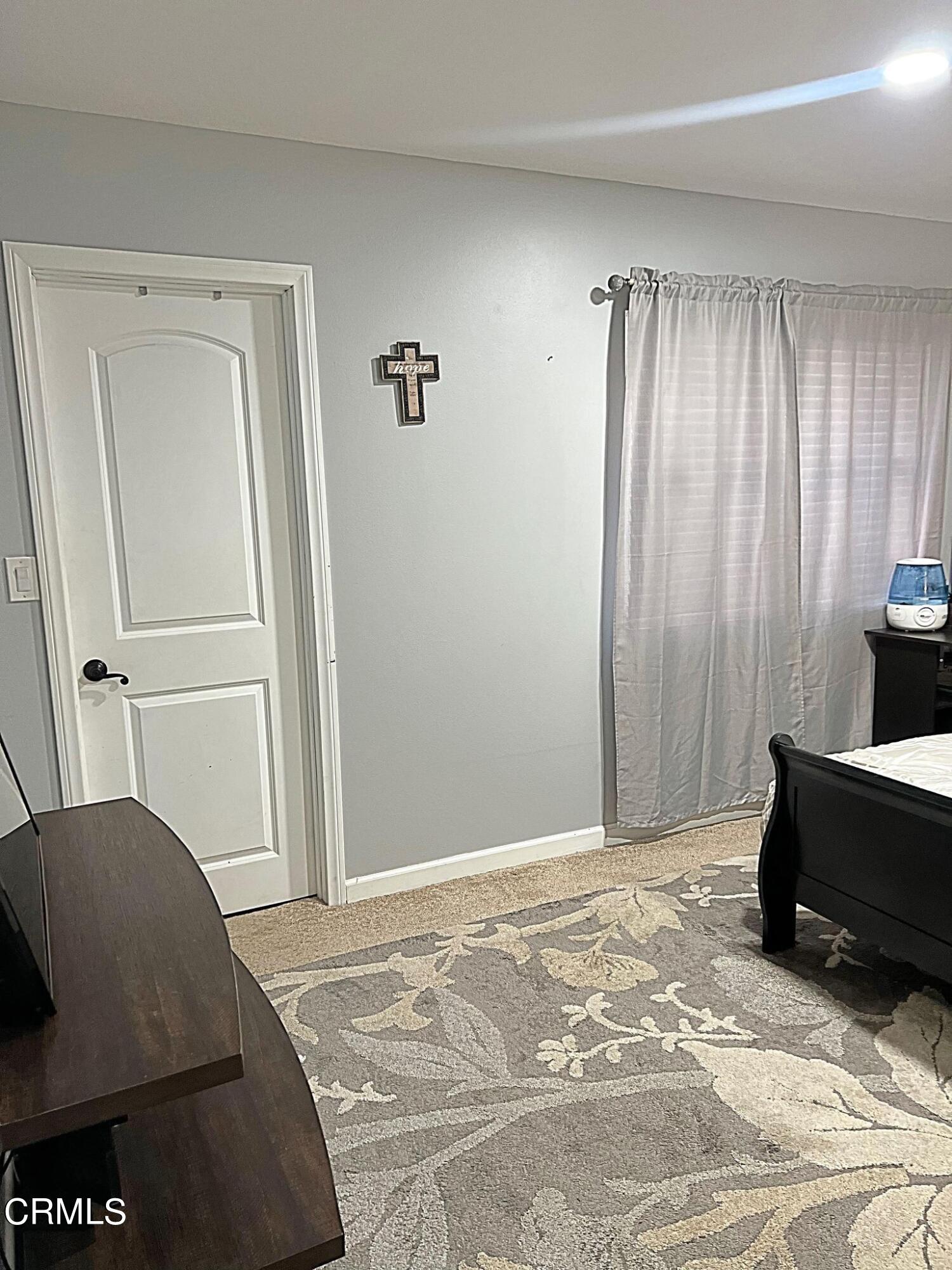 2510 Elderberry Drive, Unit 60 Oxnard, CA 93036 - Photo 14 of 37 a bedroom with a bed and a window