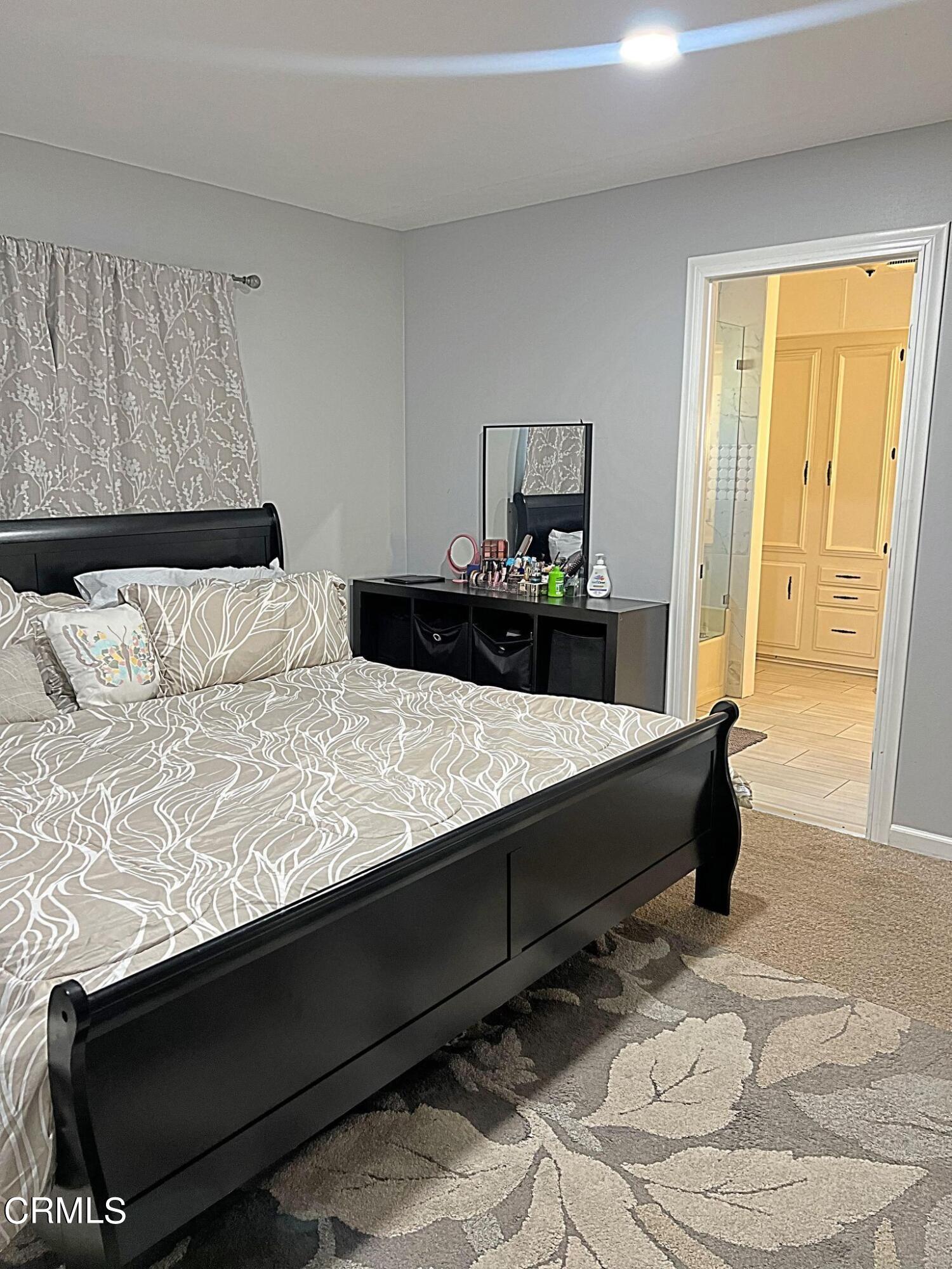 2510 Elderberry Drive, Unit 60 Oxnard, CA 93036 - Photo 15 of 37 a bedroom with a bed and wooden floor