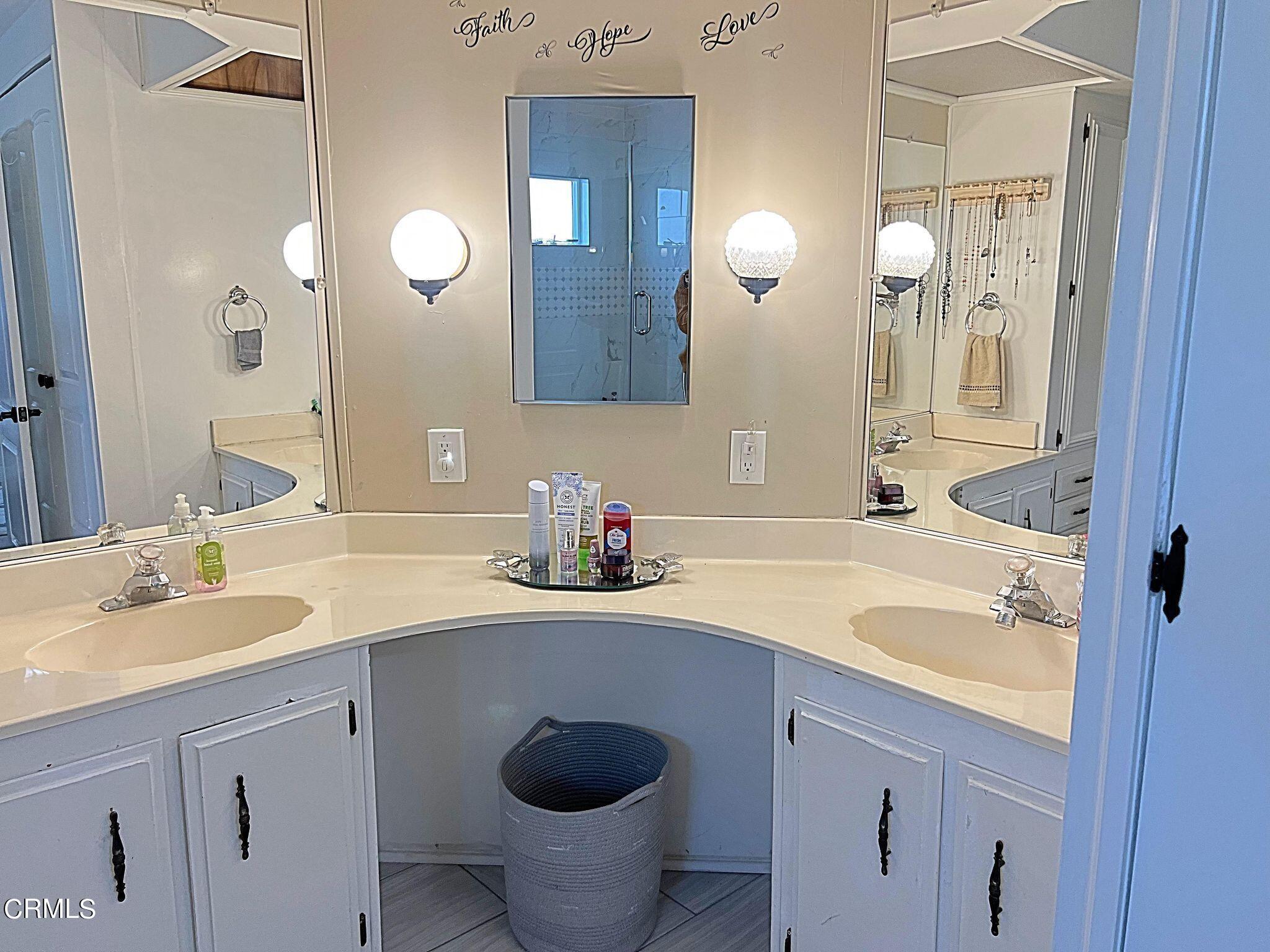 2510 Elderberry Drive, Unit 60 Oxnard, CA 93036 - Photo 18 of 37 a bathroom with a sink and a mirror
