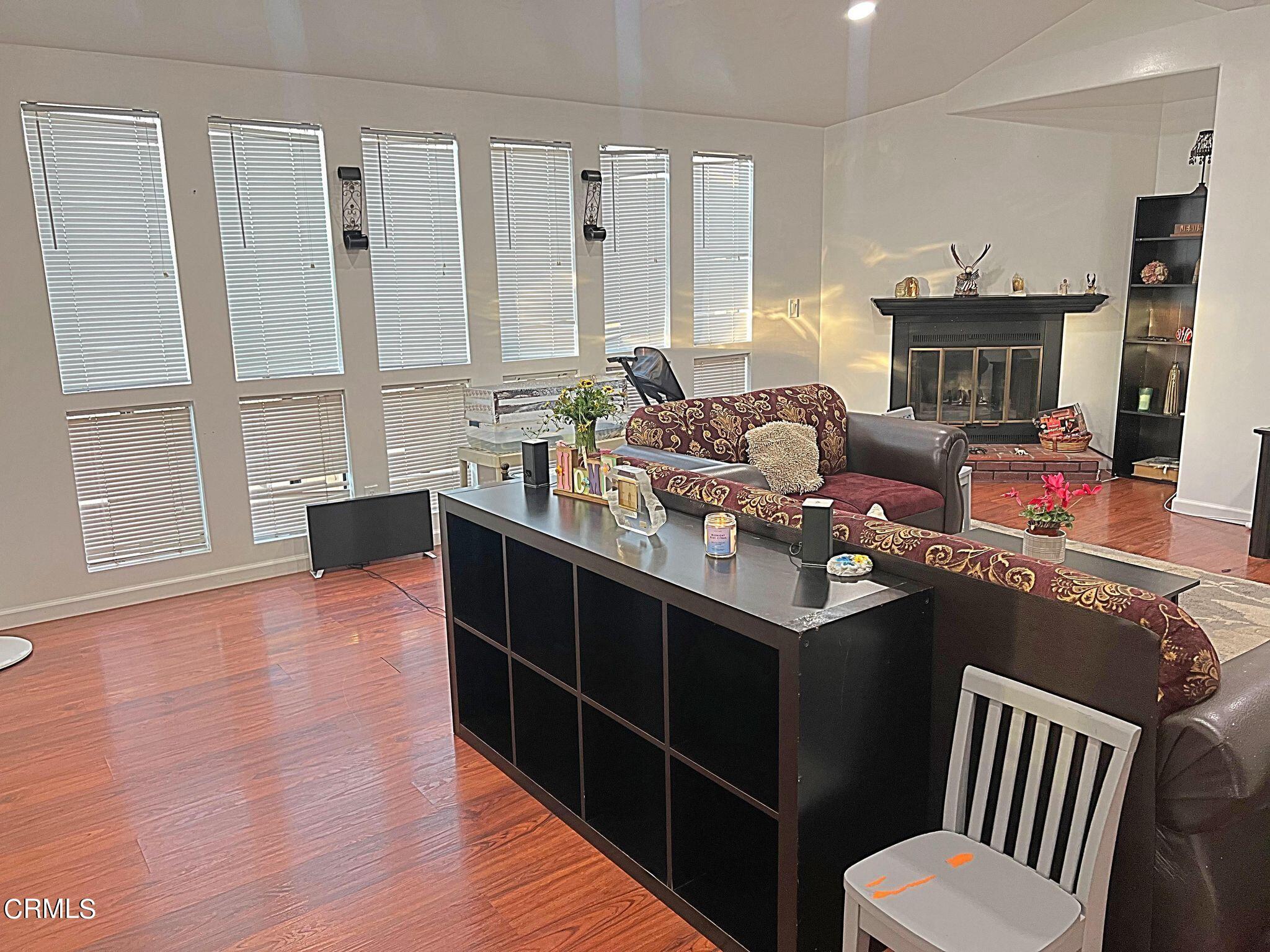 2510 Elderberry Drive, Unit 60 Oxnard, CA 93036 - Photo 9 of 37 a living room with furniture a flat screen tv and a table