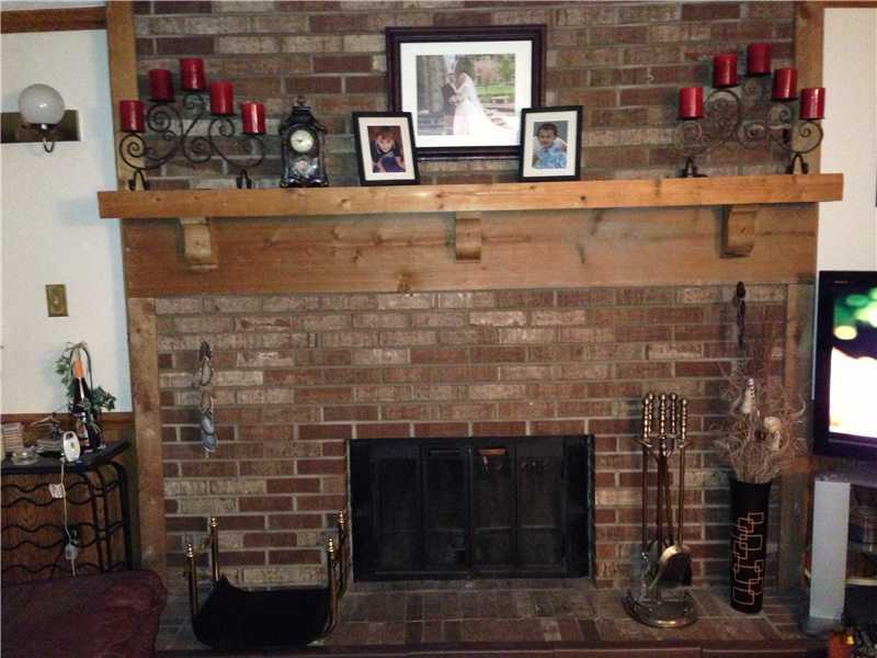 336 Partridge Run Road Gibsonia, PA 15044 - Photo 11 of 16 Den/Family/Great Room. The brick hearth fireplace accents the family room.