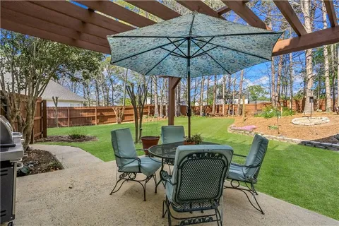 a view of a park with large trees