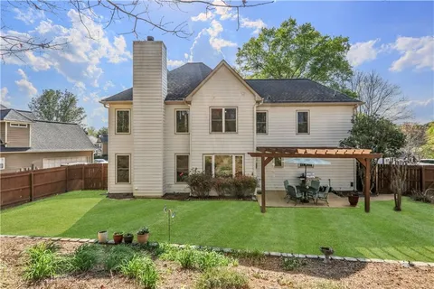 a bed room with a bed and a chandelier
