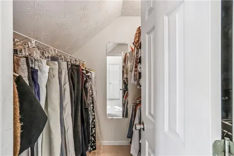 a bedroom with a bed and a table