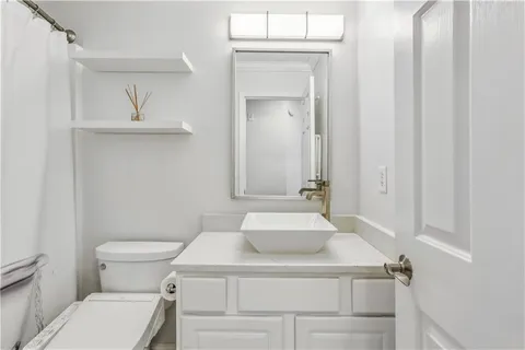 a bedroom with a large bed and a large window