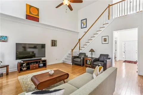 a kitchen with stainless steel appliances kitchen island granite countertop a refrigerator stove and sink