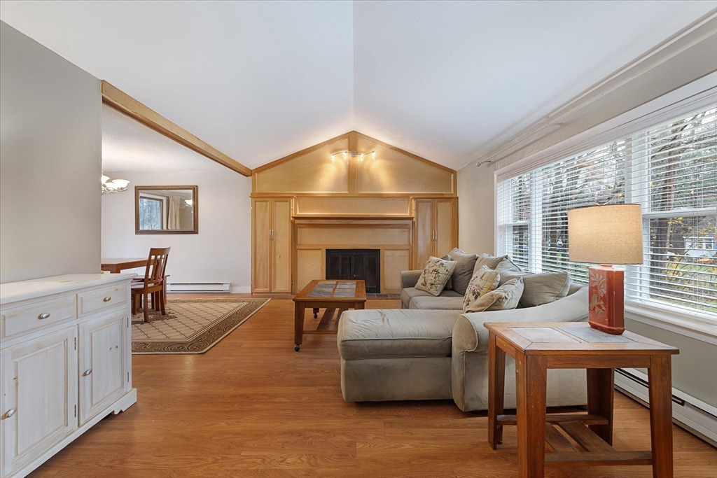 405 Cross Street Boylston, MA 01505 - Photo 4 of 34 a living room with furniture and a fireplace