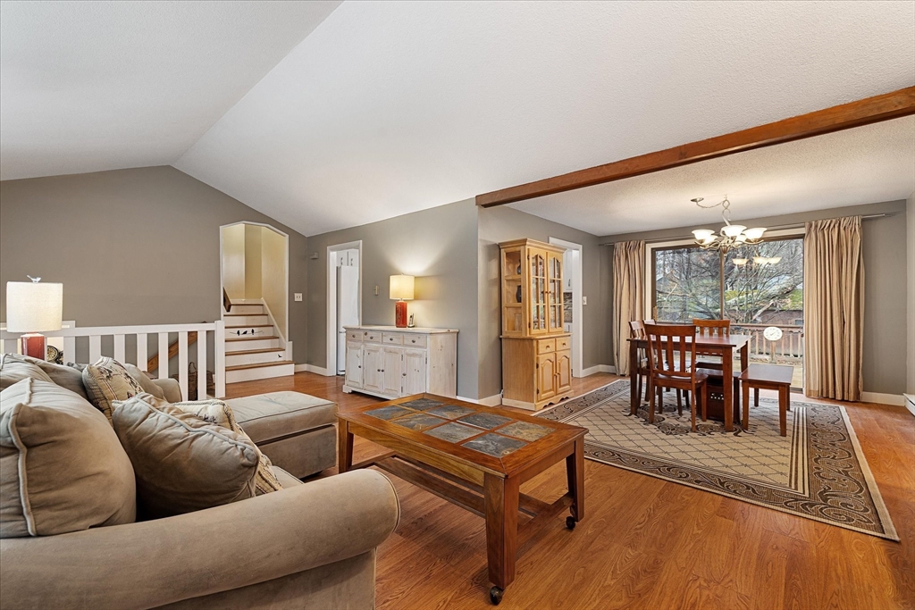 405 Cross Street Boylston, MA 01505 - Photo 7 of 34 a living room with furniture wooden floor and a floor to ceiling window