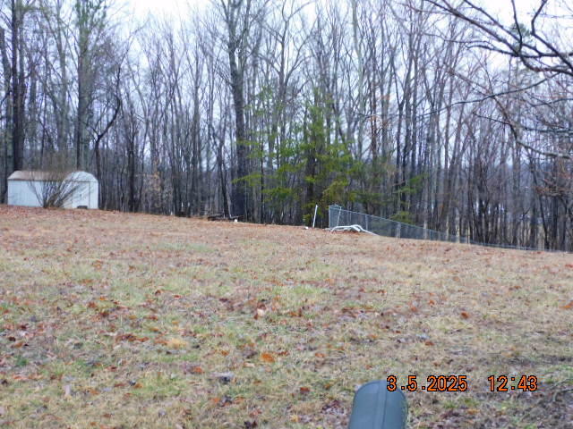 1168 Wilford Hollow Road Vinton, VA 24179 - Photo 1 of 4 a view of a backyard with large trees