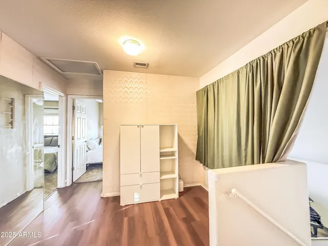 a view of entryway with wooden floor