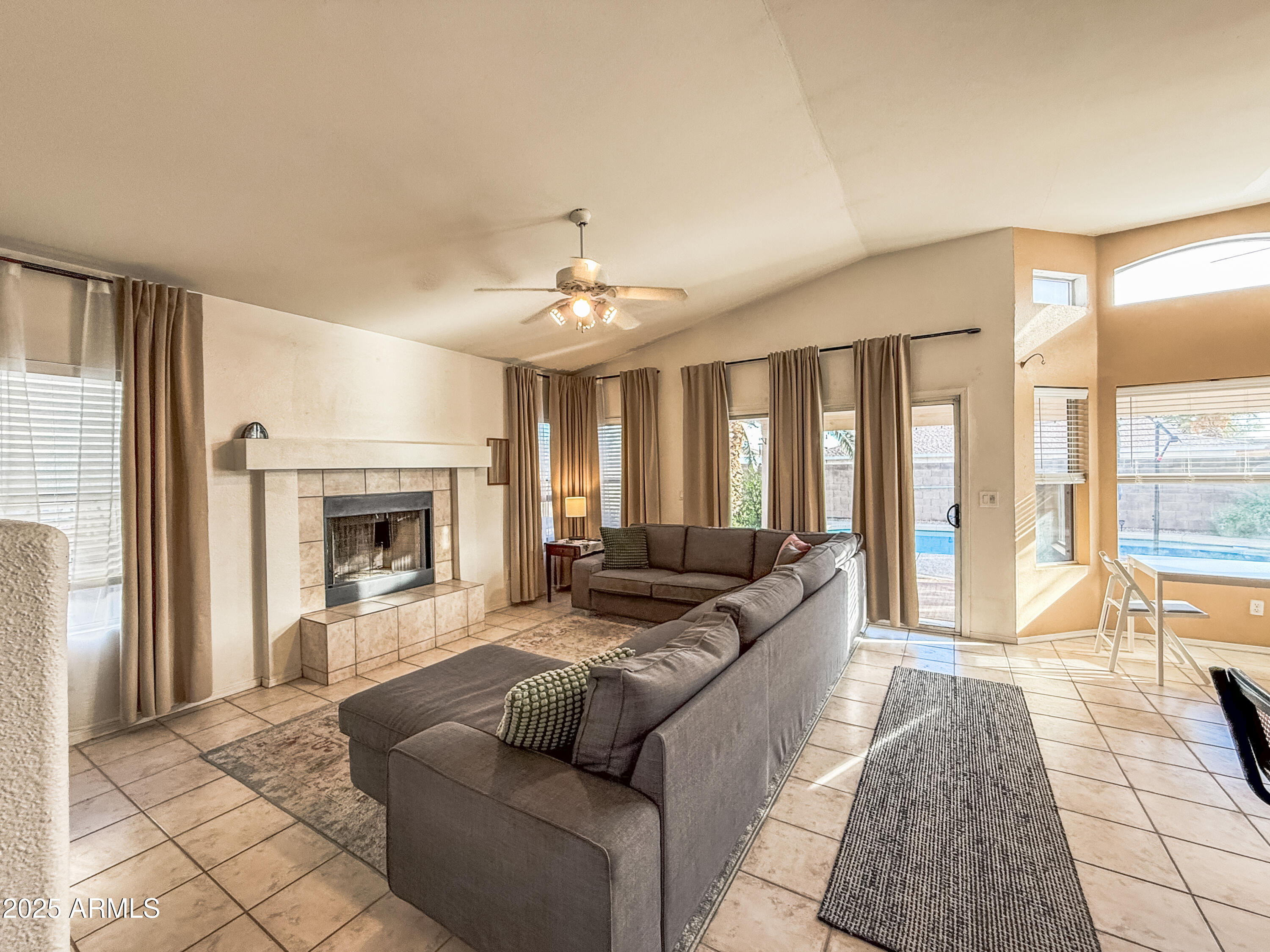 5057 East Delta Avenue Mesa, AZ 85206 - Photo 16 of 26 a living room with furniture and a fireplace