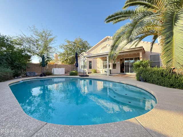 a view of a house with swimming pool