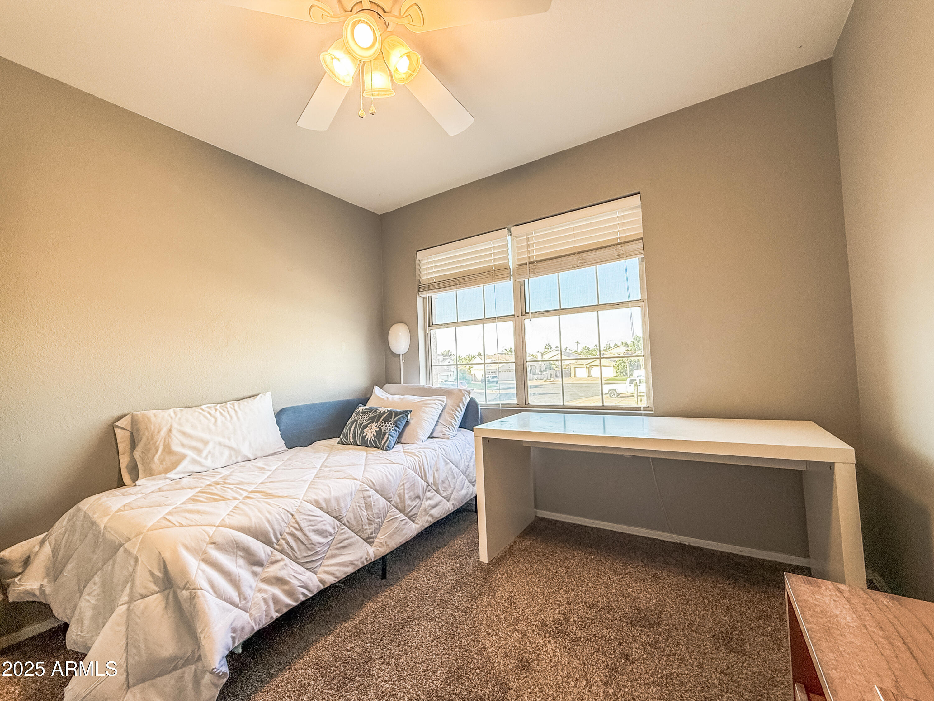 5057 East Delta Avenue Mesa, AZ 85206 - Photo 10 of 26 a bedroom with a bed and a window