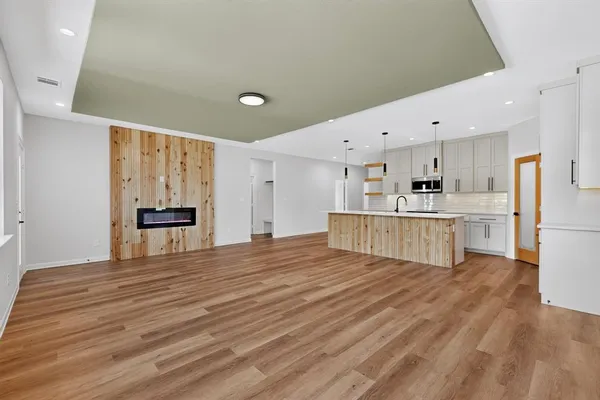 a view of kitchen with wooden floor