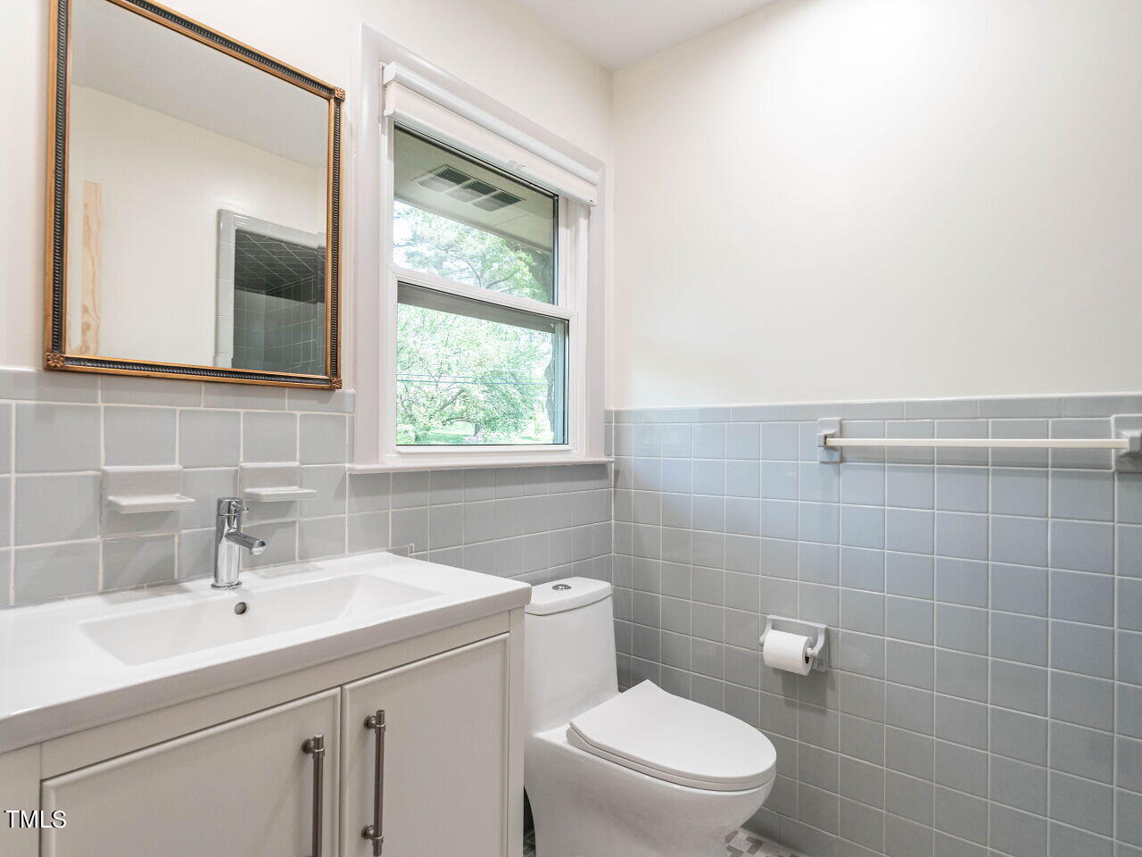 2204 Myron Drive Raleigh, NC 27607 - Photo 19 of 57 Updated bathrooms with new cabinets, low flow fixtures and dual flush toilets.