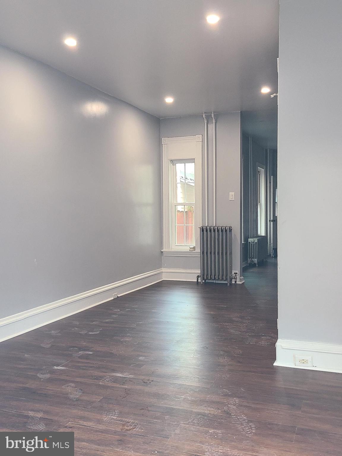 1218 Fidelity Street Reading, PA 19604 - Photo 2 of 14 a view of an empty room with wooden floor