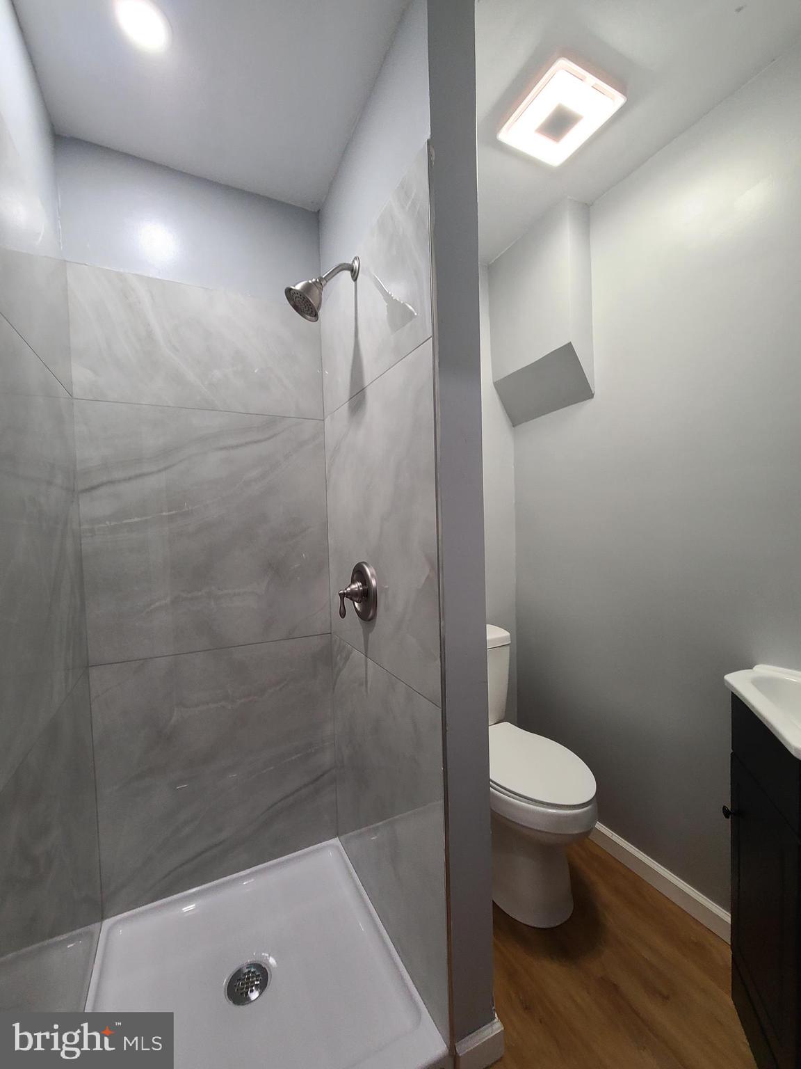 1218 Fidelity Street Reading, PA 19604 - Photo 4 of 14 a bathroom with a shower a toilet and a sink