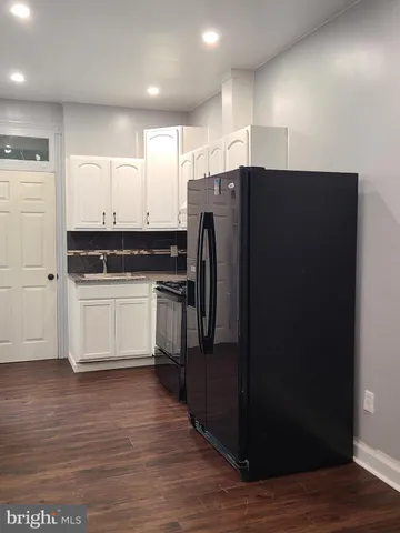 a kitchen with stainless steel appliances a refrigerator and a sink