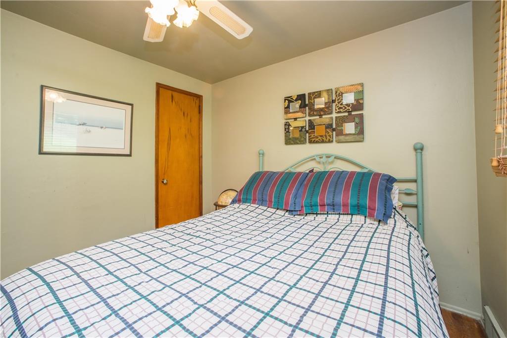 1313 McCully Road Pittsburgh, PA 15234 - Photo 14 of 25 Bedroom two has hardwood floor, ceiling fan, and single closet.