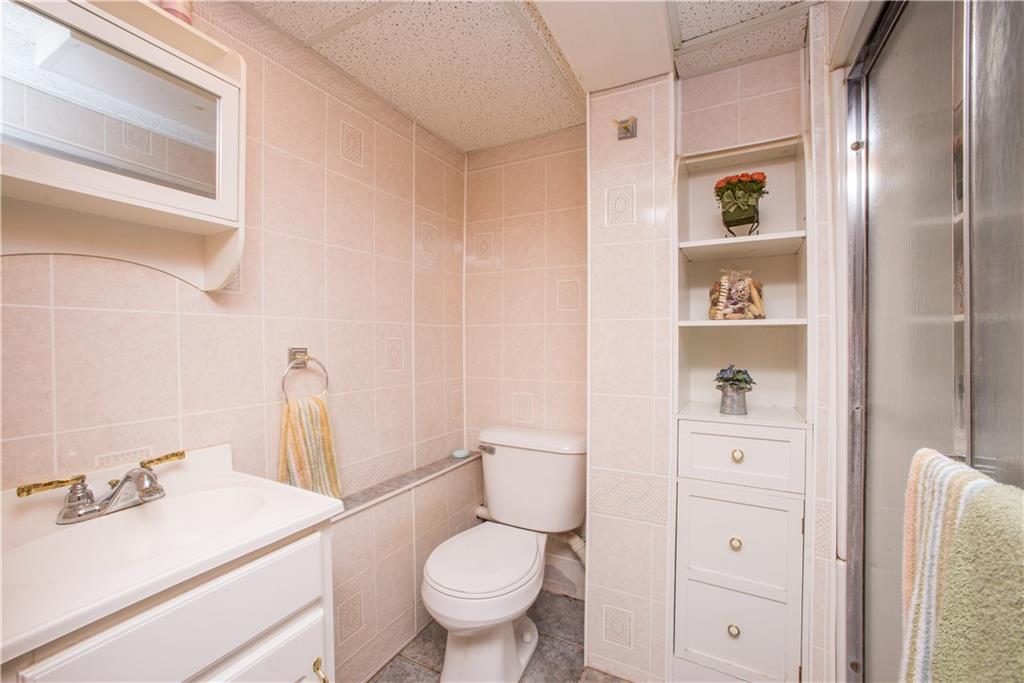 1313 McCully Road Pittsburgh, PA 15234 - Photo 18 of 25 The home's second full bath is shown here. It has a tile floor and step-in shower.