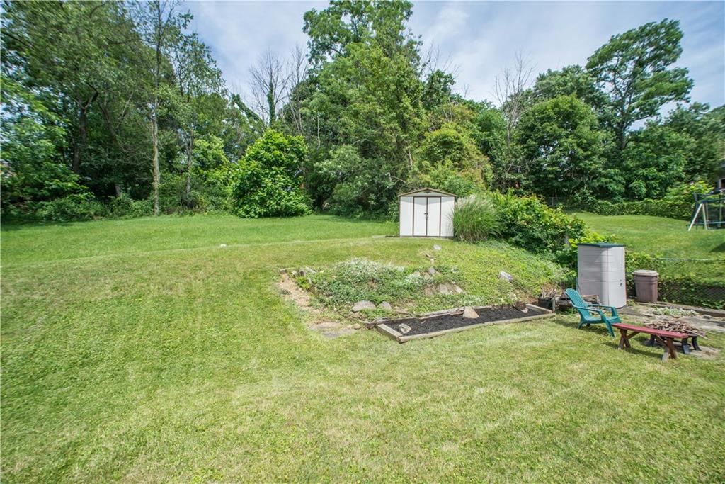 1313 McCully Road Pittsburgh, PA 15234 - Photo 23 of 25 The rear yard is large enough for entertaining, gardening, and play. The white storage shed shown on the upper area of the yard remains with the sale.